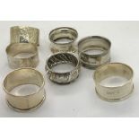 Seven silver napkin rings including 2 James Deakin + Sons, Sheffield 1882. 100.3gms.