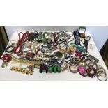 A large quantity of vintage costume jewellery including beads, bangles etc.