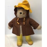 A Gabrielle Paddington Bear, slight damage to yellow hat. 48cms h.