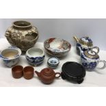 A selection of Oriental ceramics including Japanese plate warmer, 22cms d a/f, Chinese bowl, teapots