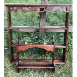 Two mahogany wall hanging display shelves. Largest 73cms w.