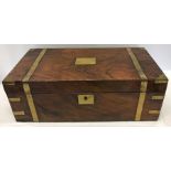 A Victorian brass bound mahogany lap desk with fitted interior containing two brass topped