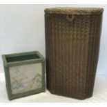 Lloyd Loom linen basket and a wicker waste basket with needlework panel.