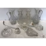 A collection of 19thC glass to include 2 jugs, two triple ring-necked decanters lacking stoppers,