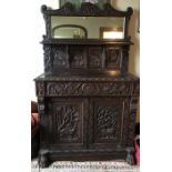 A good quality 19thC carved oak cupboard, 2 doors to base, drawer to front. 110 x 40cms d.
