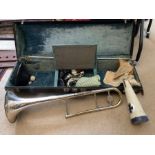 A Brass and silver plated trombone in a fitted case with 4 mutes - mouthpieces etc, maker, King 3B