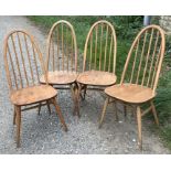 Four Mid Century Ercol Windsor dining chairs.