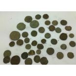 A quantity of uncleaned Roman coins.