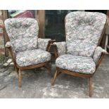 Pair of Ercol Windsor stick back armchairs with floral upholstered cushioned seating.