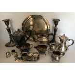 A boxed lot of silver plated items ti include tea service, candlesticks 29cms h, tray, cruet