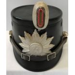 A German police black Shako hat with Westphalia badge and cockade made by Hans Romer.