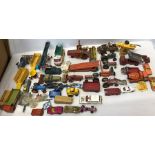 A quantity of Corgi, Matchbox and Dinky farm machinery and other vehicles.