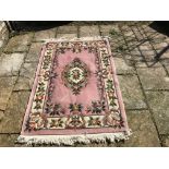 A good quality Chinese wool rug, 180 x 124cms, some marks otherwise good condition.
