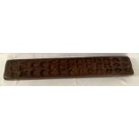 A 19thC wooden gingerbread mould. 67 x 11cms.