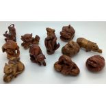 Twenty eight various modern Chinese wood and tagua nut and resin netsukes. Condition ReportTwo