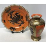 A Masons Ironstone dragon plate, 26cms d together with a vase depicting dragons. 21cms h.