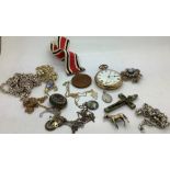 A quantity of vintage costume jewellery to include pocket watch, horse brooch, marked silver,