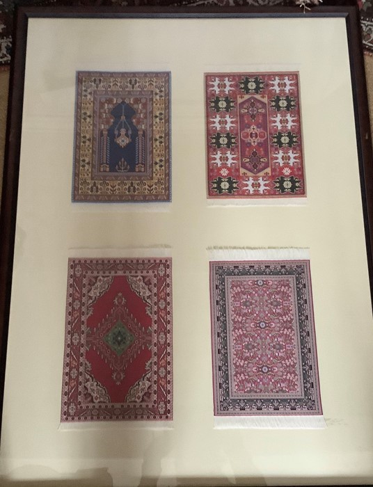 Various miniature Turkish woven rugs set in frames, 7 frames contains rugs of varying sizes. Largest