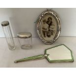 Two silver topped glass jars, good condition and oval photograph frame, 18 x 12 cms lacking strut to