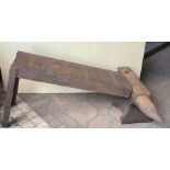 A vintage cast iron blacksmith's anvil, 82 l x 35cms h with a cast iron stand. 99 l x 62cms h.
