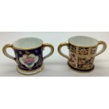 Two miniature Royal Crown Derby mugs, good condition. 4cms h.