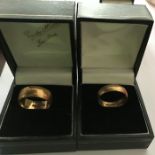 Two 18 ct gold wedding bands. 8.9gms total.