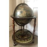 A vintage globe drinks trolley. 83cms h approximately.