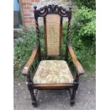 Oak barley twist armchair with cane back.