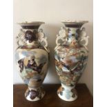 Japanese earthenware vases. 57cms h. Condition ReportChip to top of one.