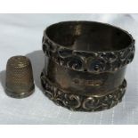 Silver napkin ring R.M.E.H Sheffield 1907. 55gms and a silver thimble with pinhole fault, PFJ