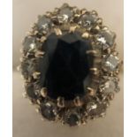 A diamond and sapphire cluster ring. Size O. 5.2gms.