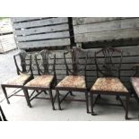 Four mahogany shield back dining chairs with drop in seats.