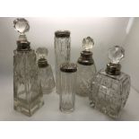 Six various silver mounted scent bottles etc, slight a/f to base of stoppers. 18cms tallest.