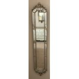 A decorative wall mirror. 112 h x 27cms w.