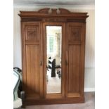 A 19thC triple beech wardrobe with central mirror door. 220h x 147 w x 52cms d.