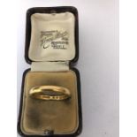 A 22 carat gold wedding ring. 4gms, Size R.