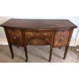 A 19thC mahogany crossbanded and inlaid sideboard on square tapered legs, brass feet and castors.