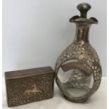 Dimple bottle mounted with Chinese white metal dragon decoration, stamped Hong Kong, 27cms h and a