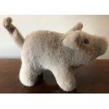 A vintage Steiff pig, 16cms l with button to ear, lacking most of tag.