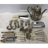 A quantity of silver plated cutlery and a leaf pattern engraved teapot together with a chrome plated