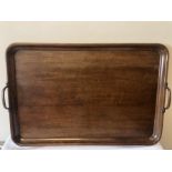 Two handled mahogany serving tray. 70 x 45.5cms. Condition ReportSplit to wood.