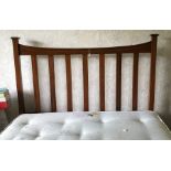 An Edwardian inlaid double bedstead. 137cms w. 4' 6''