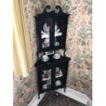 Edwardian ebonised corner glazed display cabinet. 2 glazed doors to top over 2 glazed doors to base.