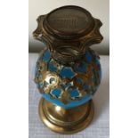 A 19thC turquoise glass and brass encased scent bottle. 9.5cms h with painted classical building