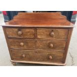 A Victorian mahogany chest of drawers on bun feet. 2 over 2. 94 h x 103 w x 46cms d.