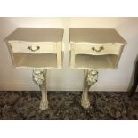 Two French style painted bedside tables on single carved wooden supports.40 w x 31cms d.