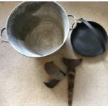 A galvanised bucket, iron boot scraper, iron last and a cast iron Falkirk 12 inch griddle pan with a
