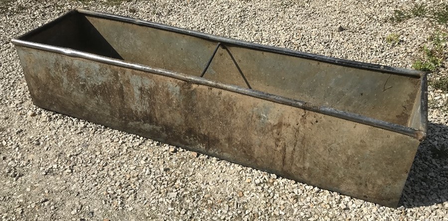 A galvanised metal agricultural water trough garden planter. 18 l x 48 w x 39cms h.