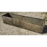 A galvanised metal agricultural water trough garden planter. 18 l x 48 w x 39cms h.