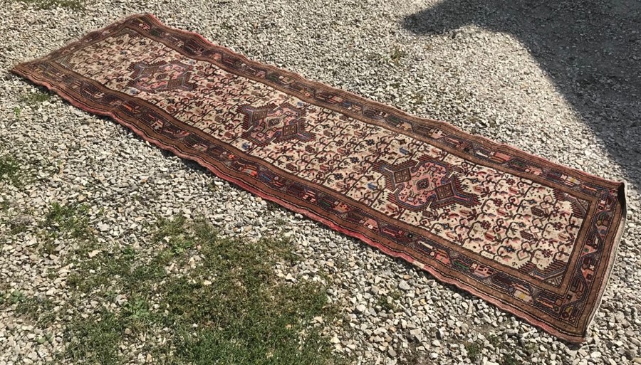 Red patterned wool runner rug. 276cms l x 79cms w. - Image 2 of 3